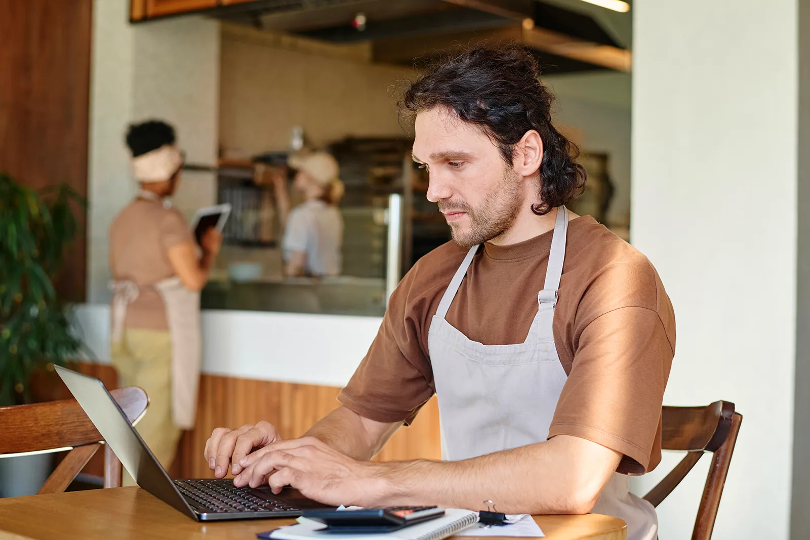 Eatery Caucasian Worker Attentively Looking Through Information Laptop Screen Sitting Table